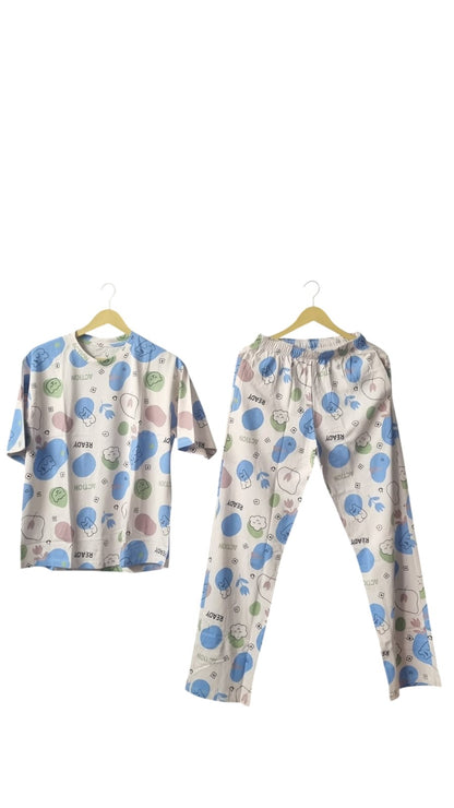 Night Suits By Aaka two-piece pajama set with pastel circles, character icons, and READY print on a grey background.